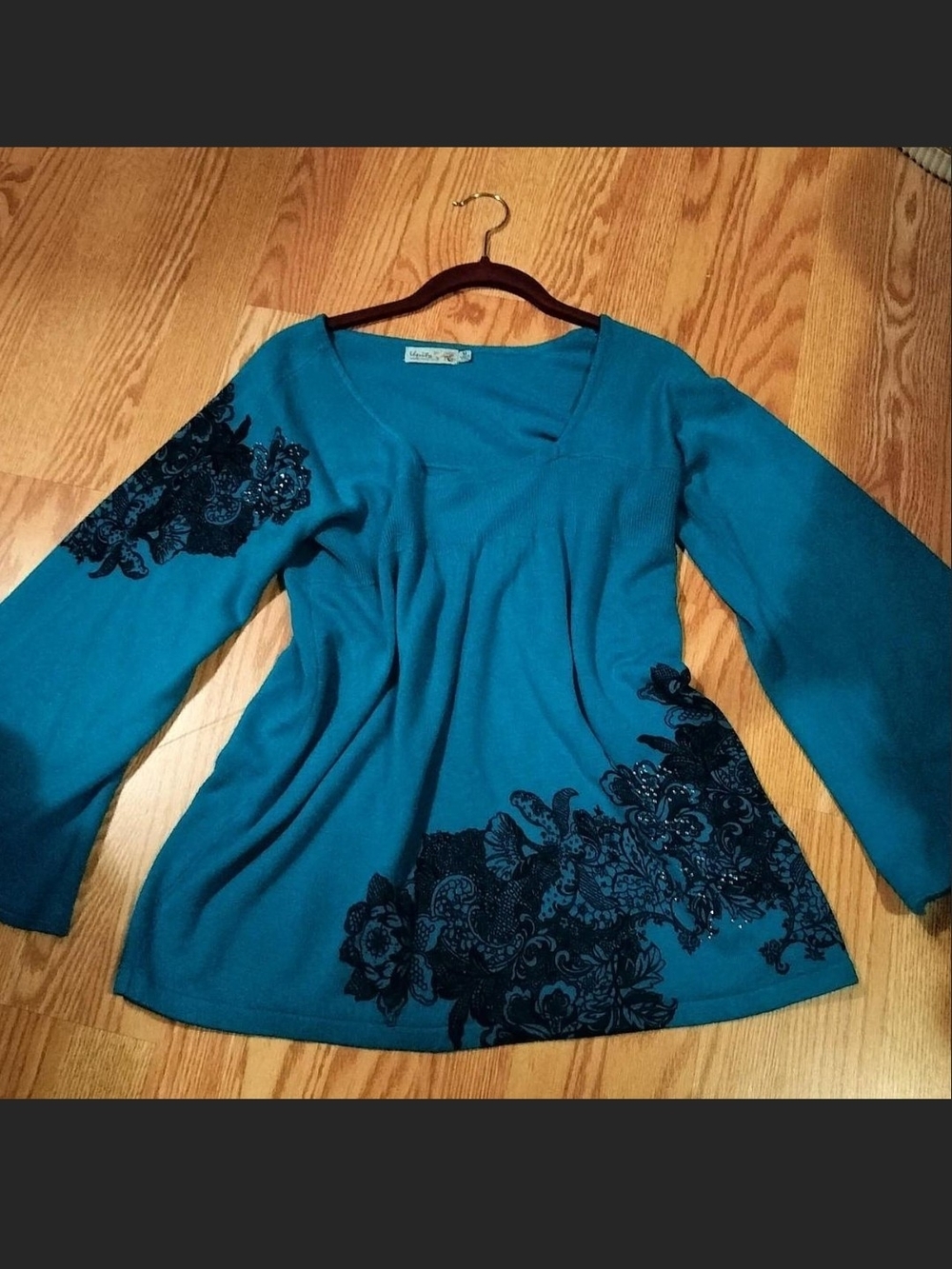 Unity World Wear Teal V-Neck Long Sleeve Top with Black Floral Embellishment